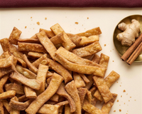 A generous spread of golden Kurma sticks with fresh ginger and cinnamon, the plant-based Discovery Box, seven sachets, one of every flavour