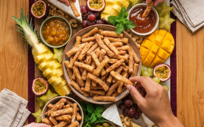Discover hub card — Entertaining with Kurma: grazing board with Kurma at the centre, hands sharing