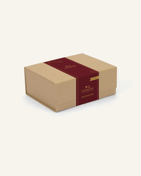 The Chungums Discovery Box wrapped in a deep burgundy and gold band with the Plant Based pennant, seven plant-based sachets, one of every flavour