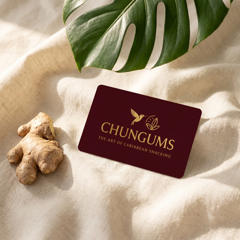 Chungums digital gift card — a deep maroon card with the gold Chungums logo, beside fresh ginger and a tropical leaf on cream linen